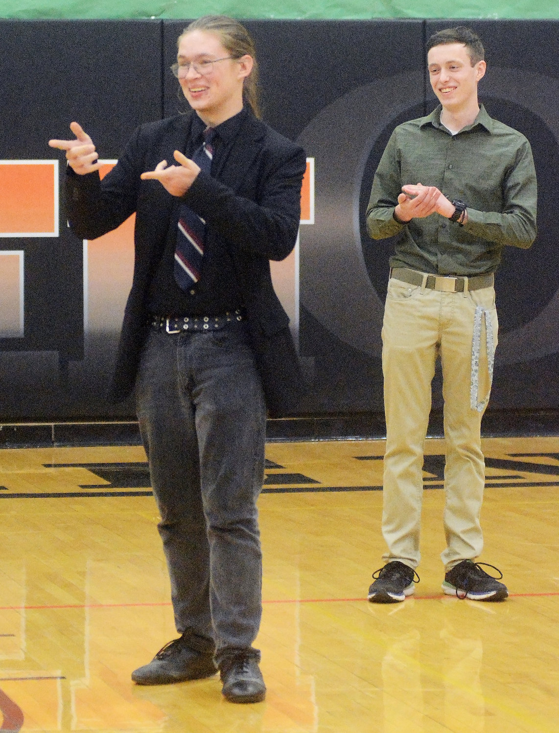 Owensville High School’s Caden Binkhoelter reacts  at being named winner of the $10,000 Gasconade County Math and Science Scholarship given by the Gerald Ebker family. Applauding (right) was Binkhoelter’s OHS Class of 2022 classmate Michael Lowes who was among the 12 students from OHS and Hermann to compete for the scholarship through a testing process.